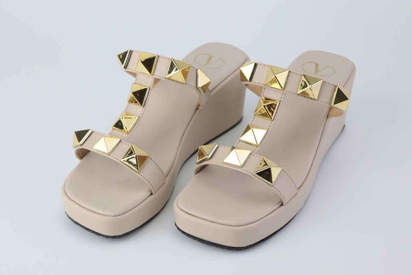 Golden Elegance: Embracing Comfort with Valentino's Roman Stud Wedge Sandals Pakistan